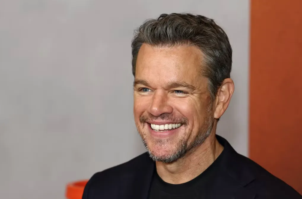 Water.org cofounder Matt Damon smiles in front of a white background.