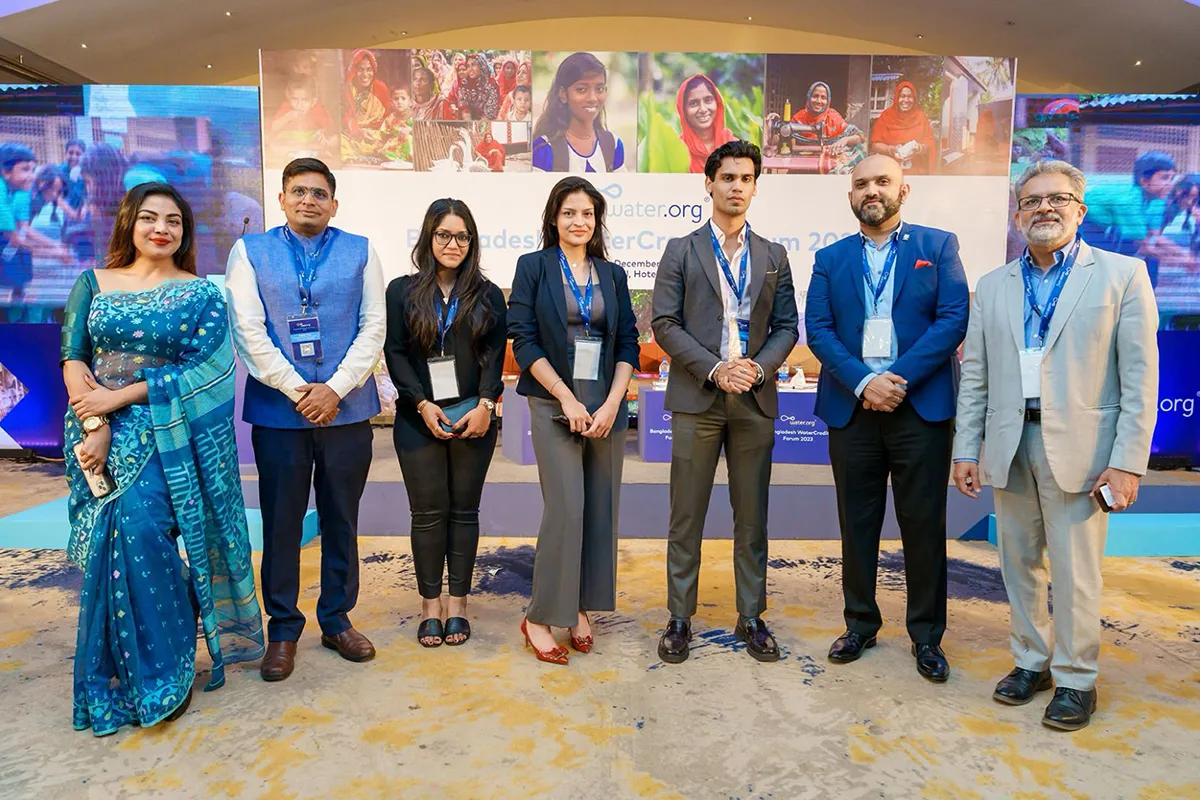 Group of Water.org employees standing together at an event.