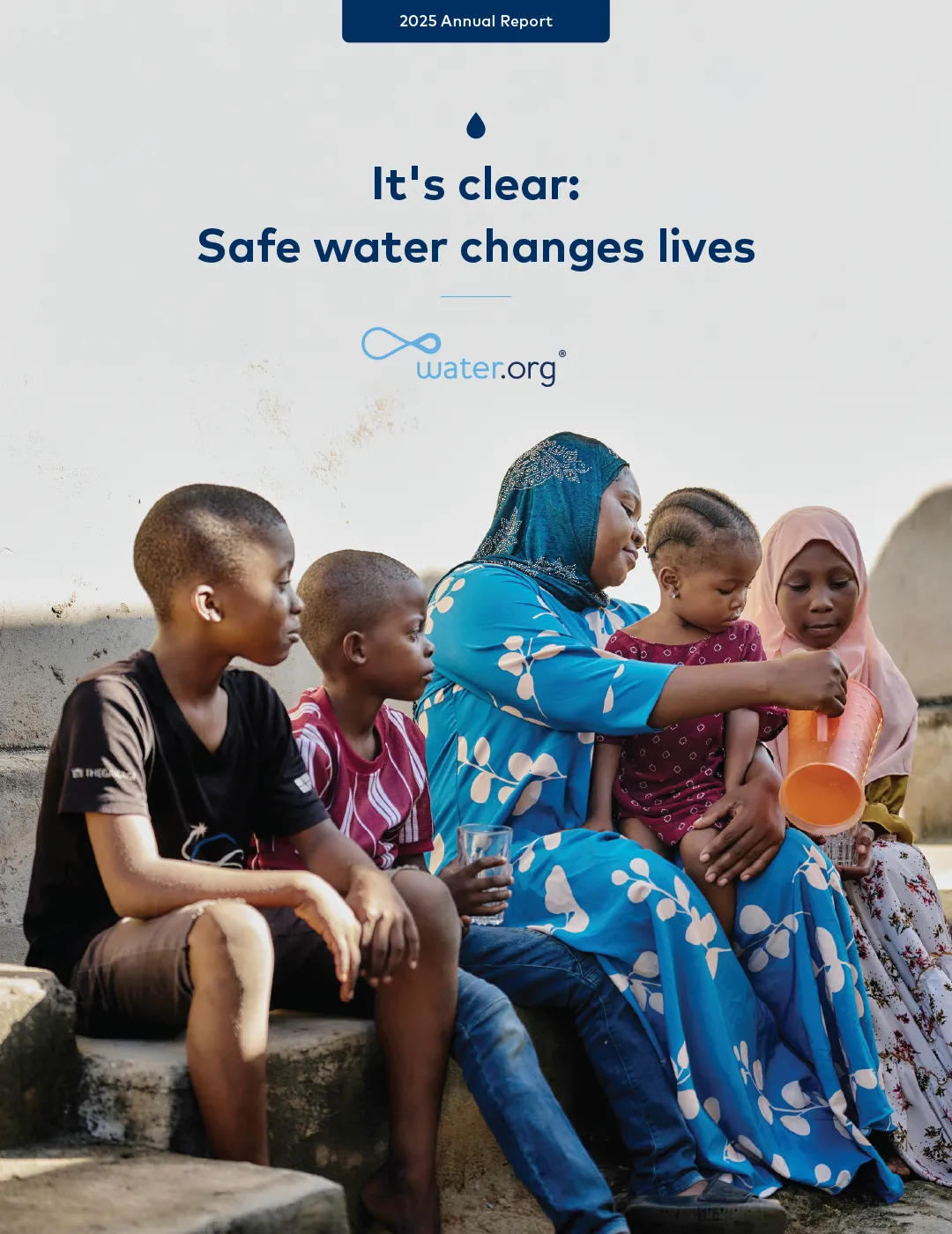 Water.org 2025 annual report cover. Mother sitting with 4 children pouring water in their drinking glasses.