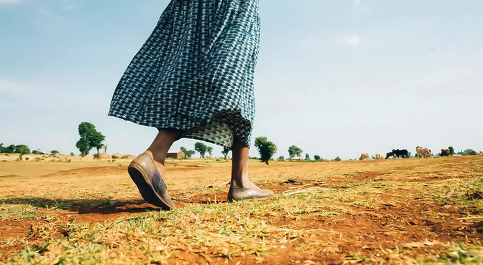 A woman in Ethiopia walks to get water